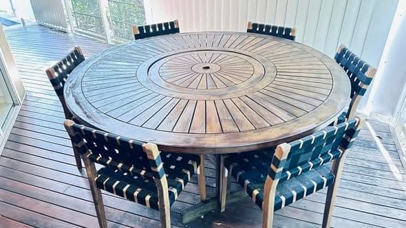 Weathered teak outdoor setting ready for restoration